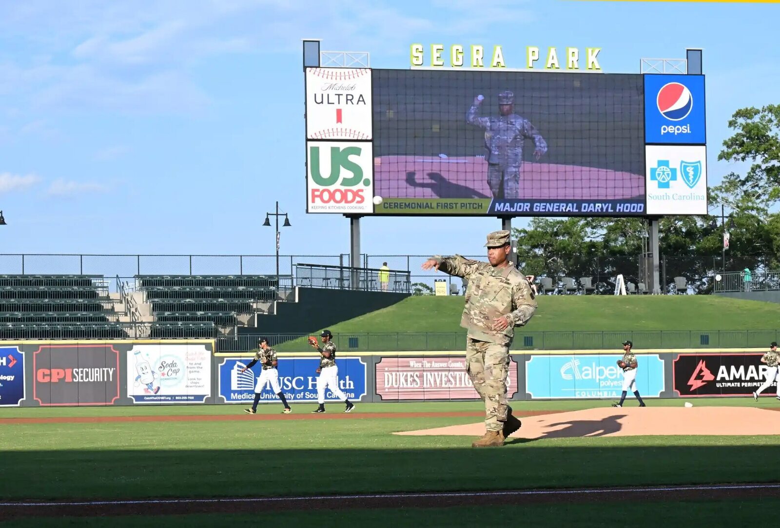 A Columbia Fireflies game at Segra Park, with the scoreboard over the outfield